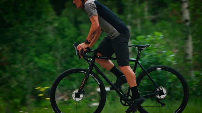 A Cyclist Riding a Steel Gravel Bike. Concept for Benefits of Steel Gravel Bikes