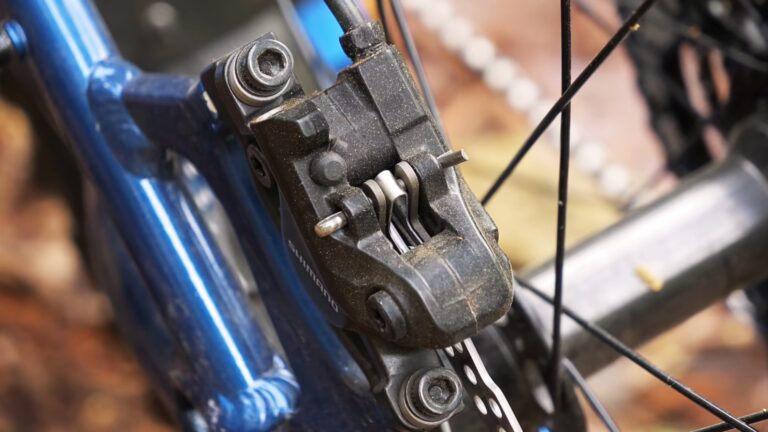 Comparison of Hydraulic and Mechanical Brakes for Bicycles. Closeup of Shimano Brakes