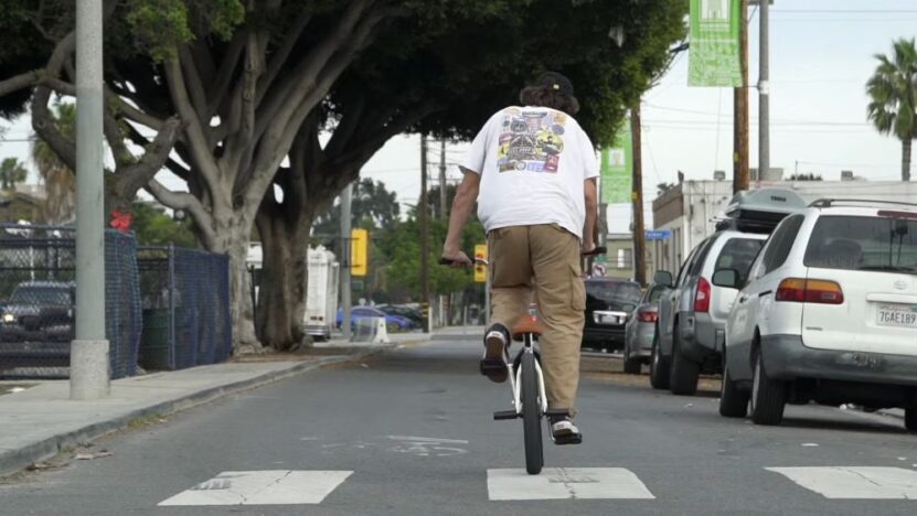 Guy riding Fit BMX bike on the road 