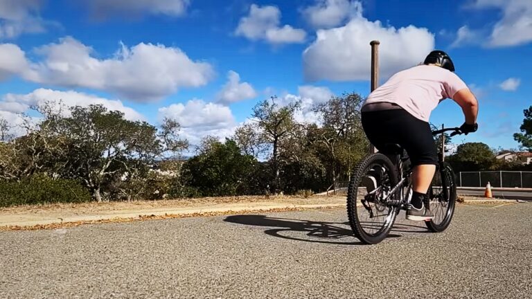 An Overweight Man Riding a Bicycle